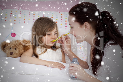 Composite image of little girl in bed taking syrup