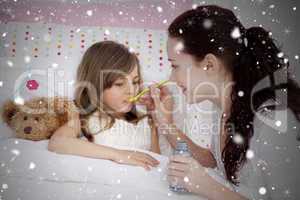 Composite image of little girl in bed taking syrup