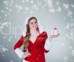 Composite image of pretty girl in santa costume holding gift box