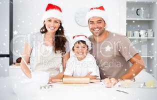 Portrait of a happy family preparing christmas cookies