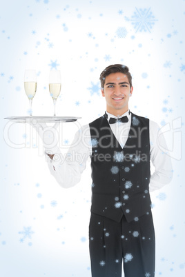 Young waiter presenting a silver tray
