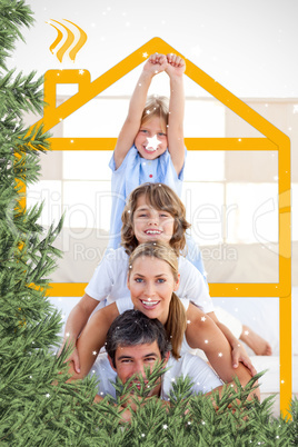 Composite image of family having fun with yellow drawing house