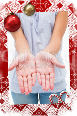 Casual young woman holding hands out