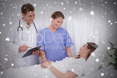 Composite image of medical team talking to patient