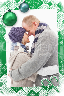 Composite image of happy mature couple in winter clothes hugging