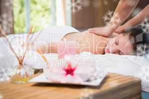 Attractive woman receiving back massage at spa center