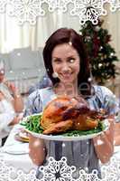 Woman showing to the camera christmas turkey