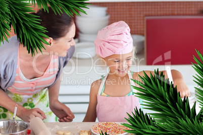 Cheerful mother and her daughter baking in a kitchen