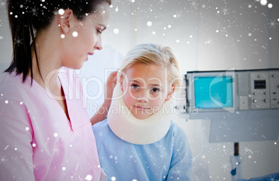 Sad little girl with a neck brace sitting with her nurse