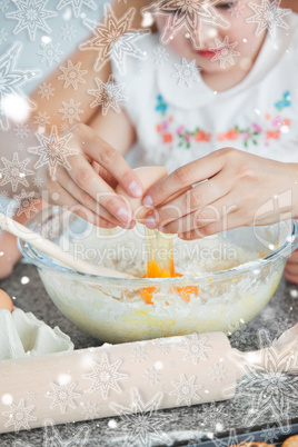 Mother and small child baking cookies