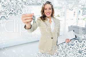 Beautiful happy woman handing over house keys