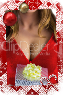 Composite image of sexy santa girl holding gift