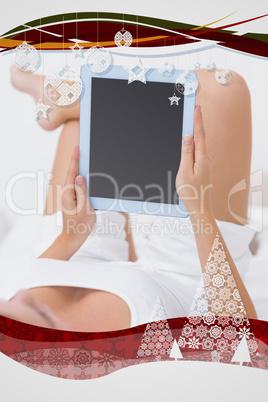 Calm woman touching her tablet pc