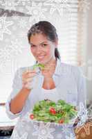 Portrait of a happy woman eating a salad