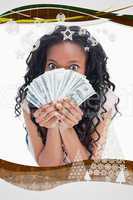 Woman is holding american dollars up to her face