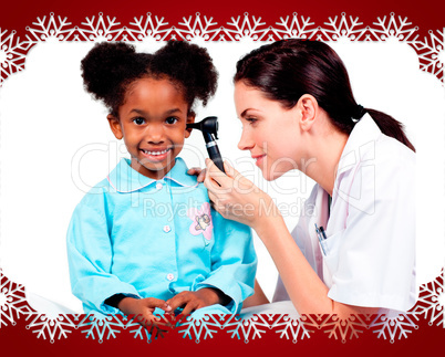 Female doctor checking her patients ears