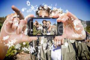 Hand holding smartphone showing photo