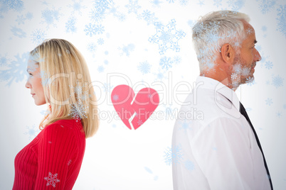 Couple not talking with broken heart between them