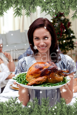 Woman showing to the camera christmas turkey