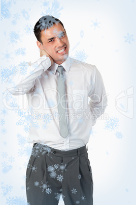 Portrait of a young businessman having a back pain