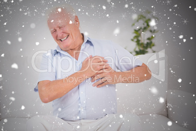 Composite image of old man suffering with heart pain