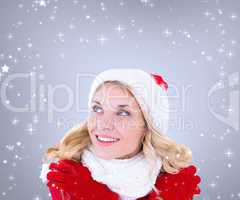 Composite image of happy festive blonde