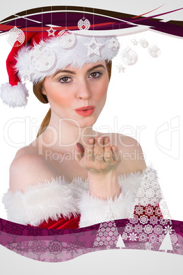 Composite image of pretty girl in santa costume holding hand out