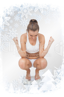 Composite image of successful young woman crouching on a scales