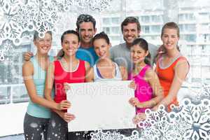 Fit smiling people holding blank board