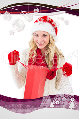 Composite image of festive blonde holding shopping bag