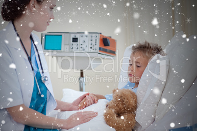 Composite image of female doctor examining a child in bed