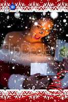 Composite image of pretty brunette in santa outfit opening gift