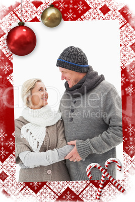 Composite image of happy mature couple in winter clothes