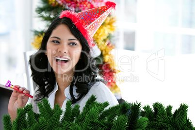 Composite image of positive businesswoman celebrating christmas