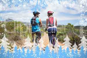 Fit couple about to cycle on mountain trail