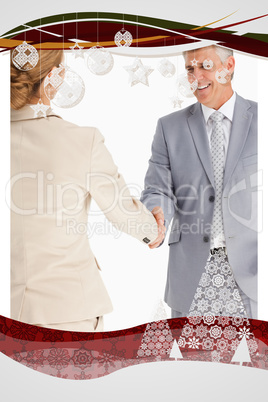 Composite image of happy business people shaking hands