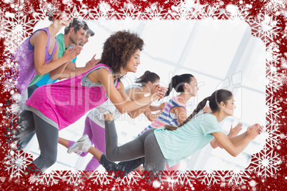 Fitness class and instructor doing pilates exercise