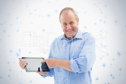Happy mature man pointing to his tablet pc