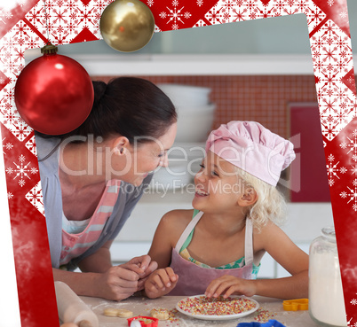 Lovely mother and her daughter baking in a kitchen