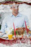 Attractive man sitting at table for christmas dinner