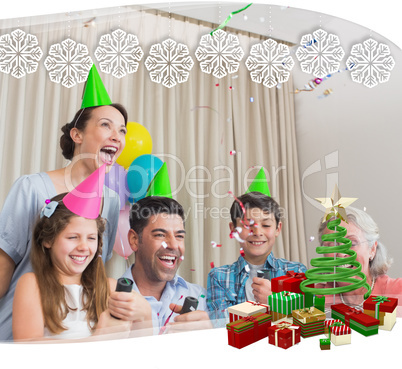 Cheerful extended family playing with christmas crackers
