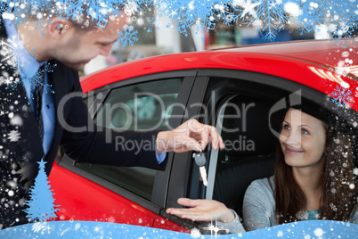 Composite image of customer receiving car keys