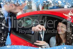 Composite image of customer receiving car keys