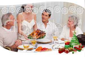 Woman showing turkey to her family for christmas dinner