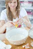 Attractive woman preparing a cake in the kitchen