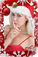 Woman in santa hat making silence gesture