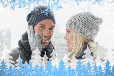 Cute couple in warm clothing hugging