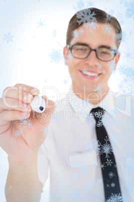 Nerdy businessman writing with black marker