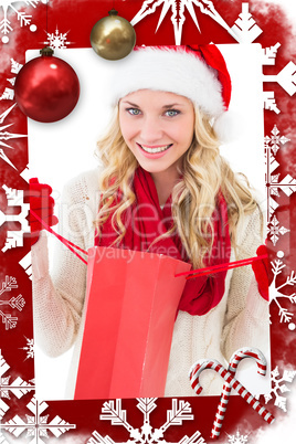 Festive blonde holding shopping bag