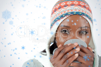 Student woman enjoying a cup of tea in the cold